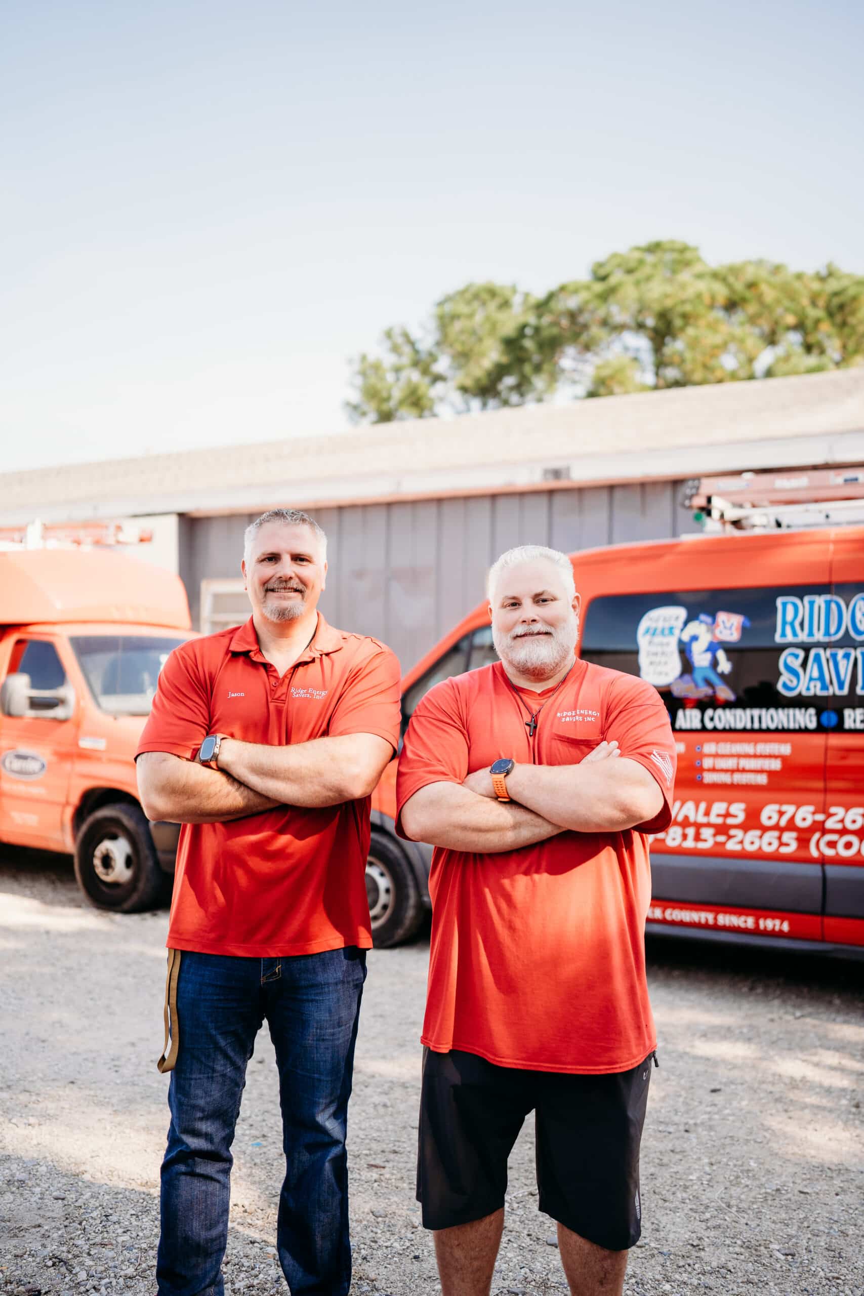 Residential service professionals with their company vehicles
